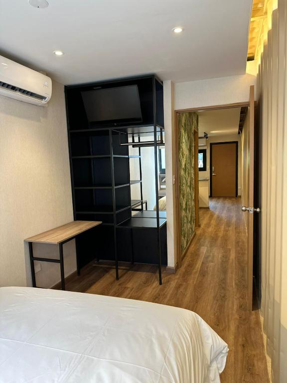 Postel nebo postele na pokoji v ubytování Nomada Republic Hotel Panama City