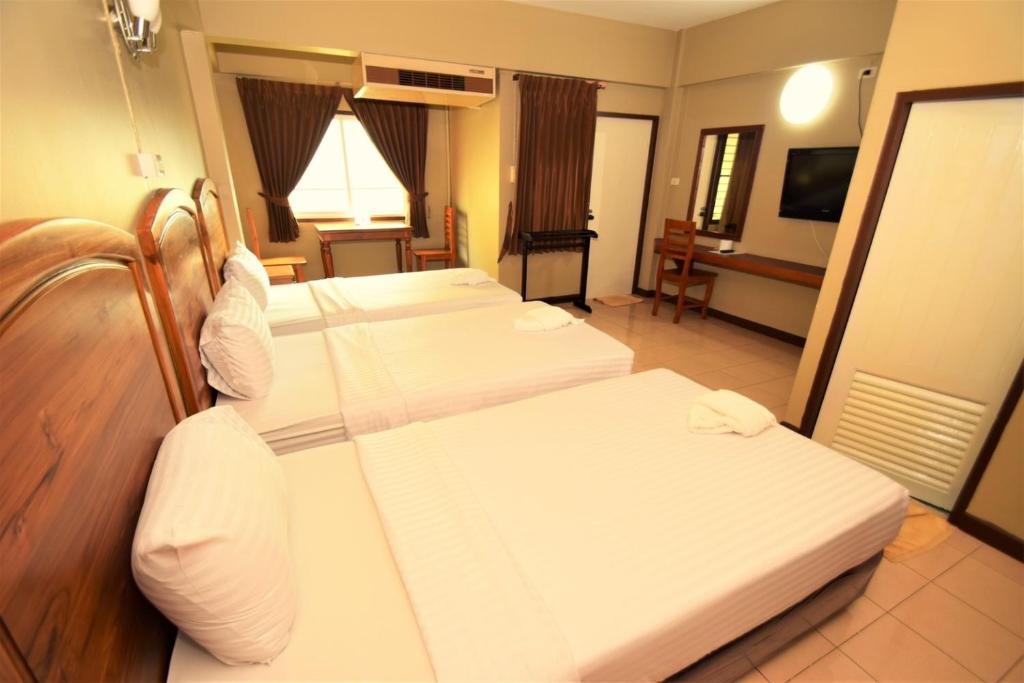 Postel nebo postele na pokoji v ubytování Best LD Hotel โรงแรมเบส แอลดี