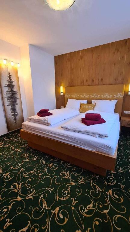Postel nebo postele na pokoji v ubytování Gästehaus Huber