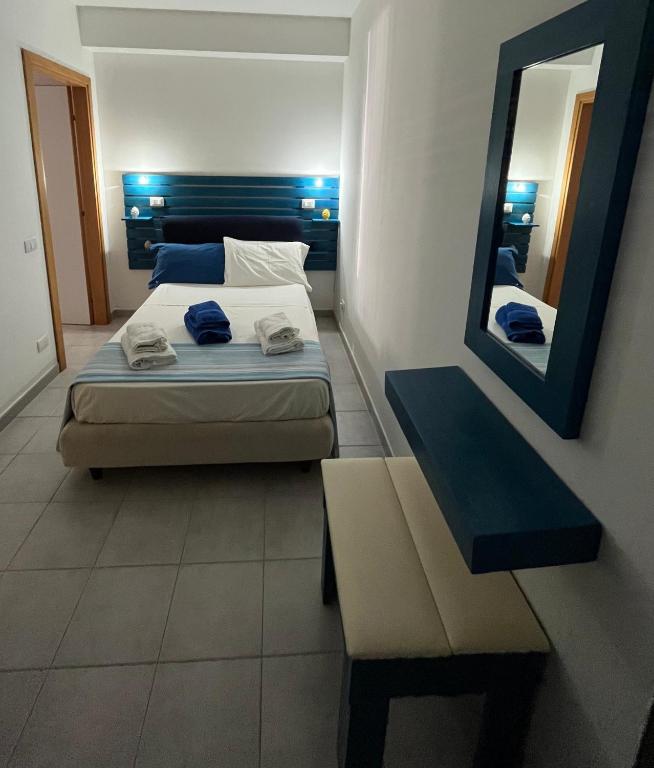 Postel nebo postele na pokoji v ubytování Luna's House Fondachello