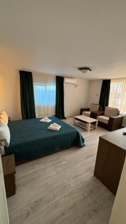 Postel nebo postele na pokoji v ubytování Hotel Falkor