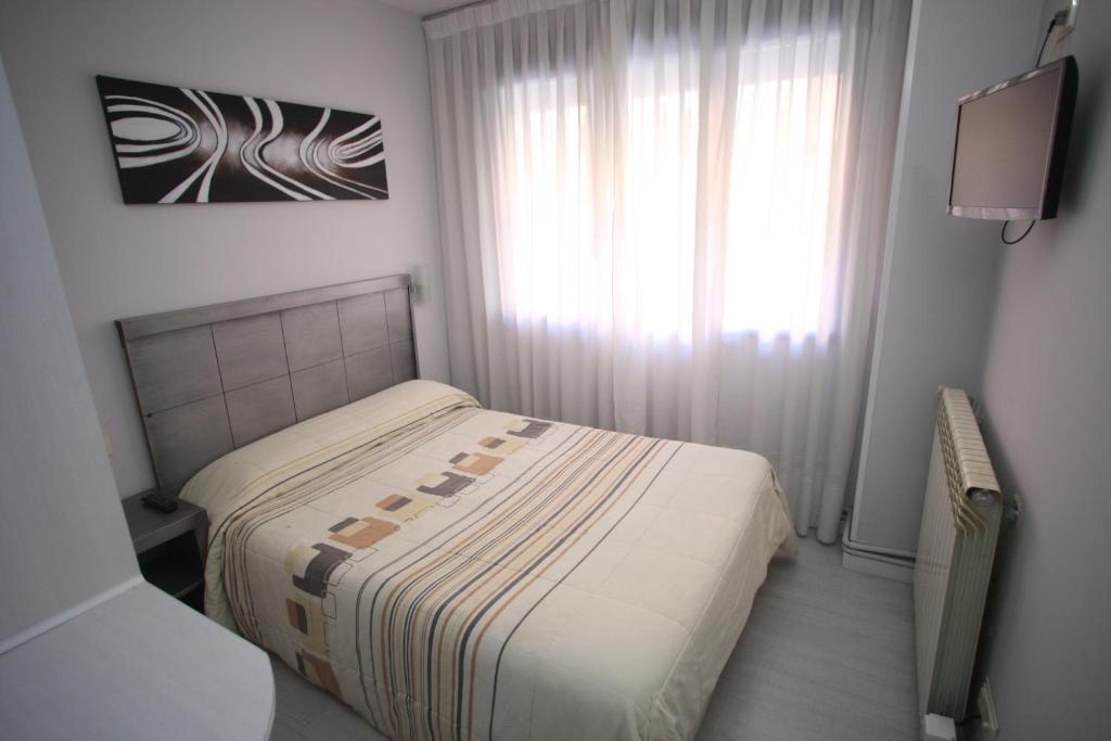 Postel nebo postele na pokoji v ubytování Hostal Santa Barbara