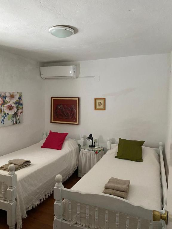 Postel nebo postele na pokoji v ubytování Casa Amparo casco histórico