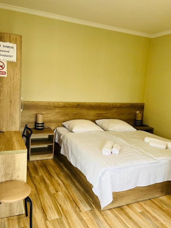 Postel nebo postele na pokoji v ubytování Soso Burduli's Guesthouse