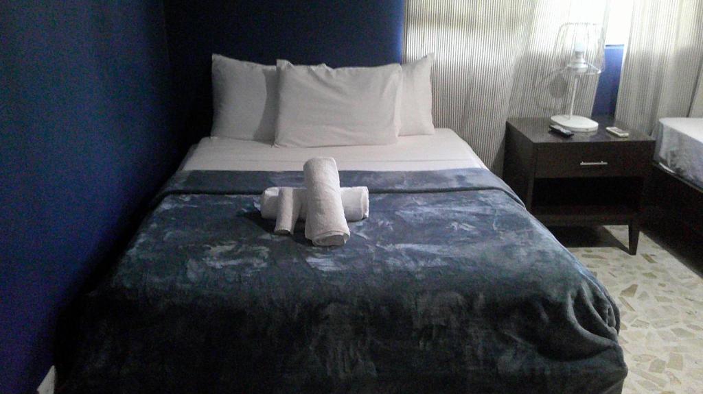 Postel nebo postele na pokoji v ubytování E&J Boutique Residences