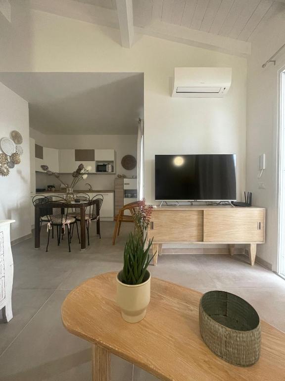 a living room with a large flat screen tv at Villa Adele in Valledoria