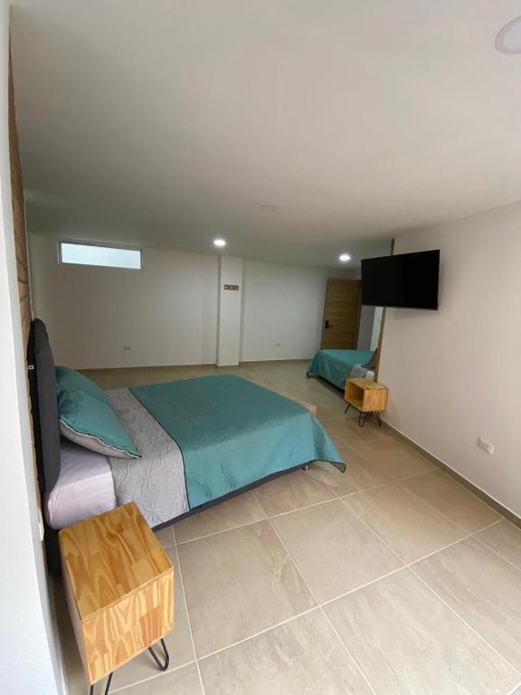 Postel nebo postele na pokoji v ubytování BISÁU Hotel