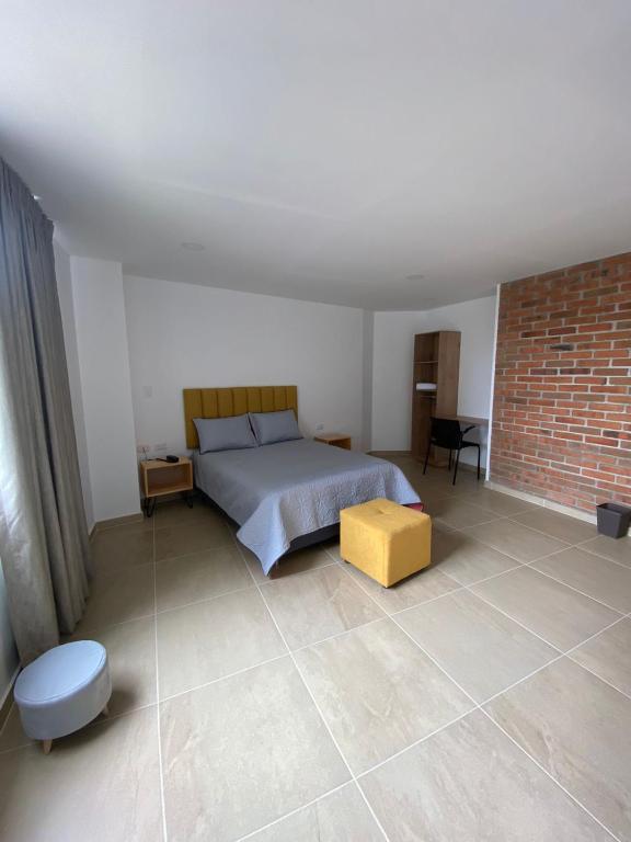 Postel nebo postele na pokoji v ubytování BISÁU Hotel