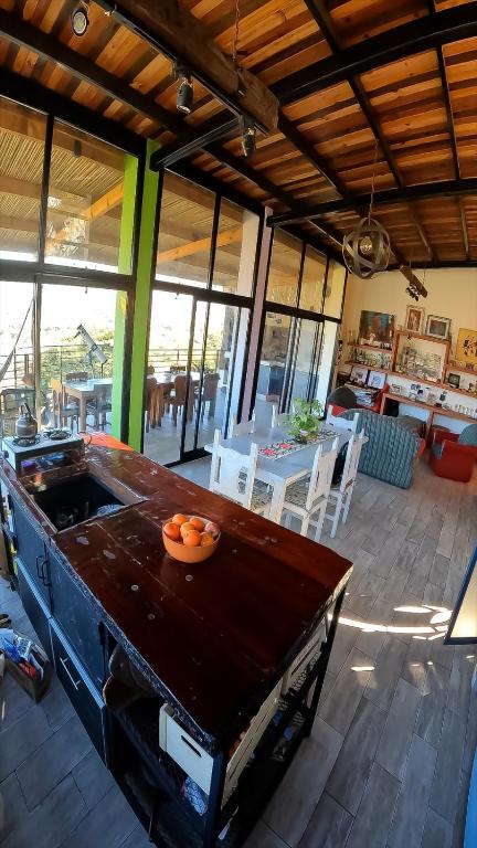 a kitchen with a table with a bowl of oranges on it at Valle Hermoso Salta in Salta