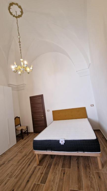 Postel nebo postele na pokoji v ubytování TRICASE Home