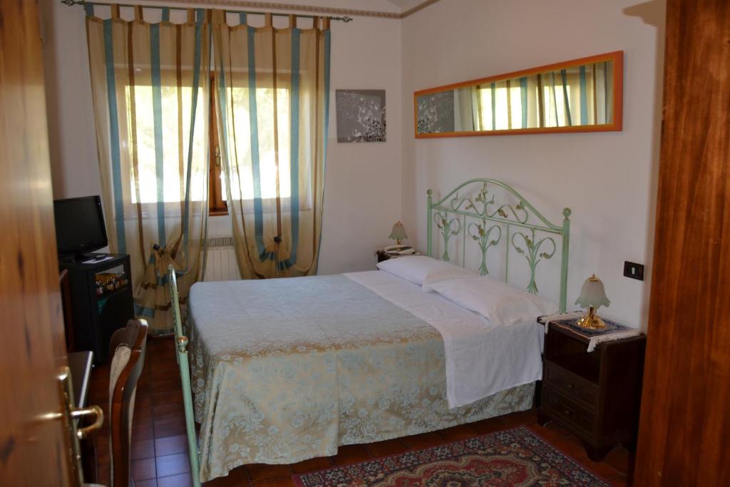 Postel nebo postele na pokoji v ubytování Hotel Canusium