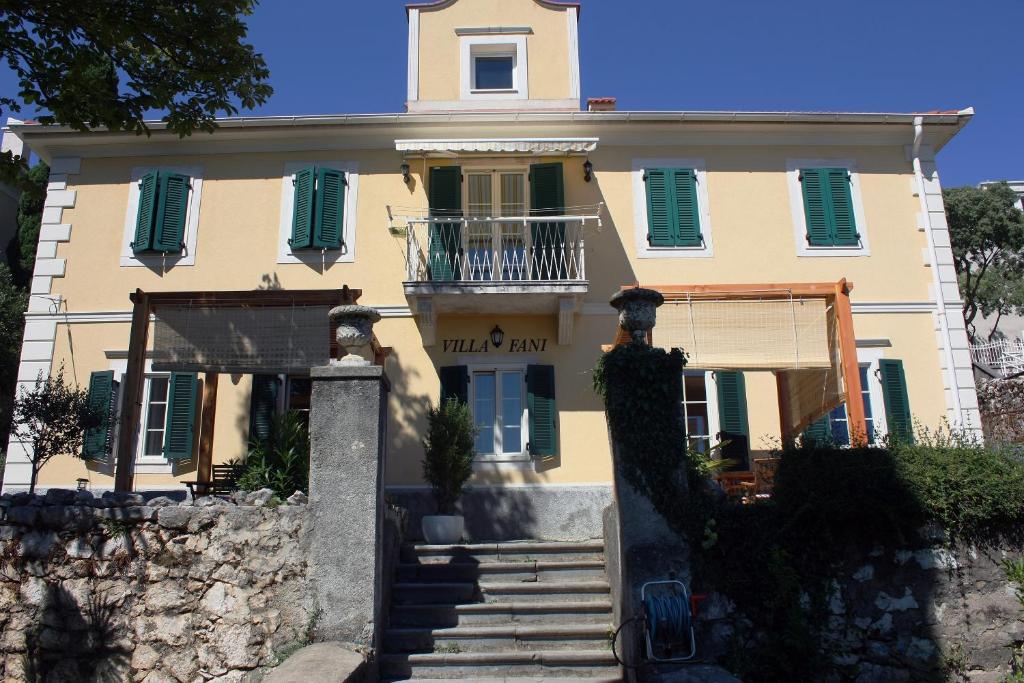 a building with a staircase in front of it at Villa Fani in Rijeka