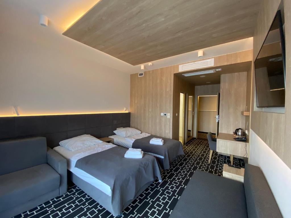 Postel nebo postele na pokoji v ubytování Hotel Wena