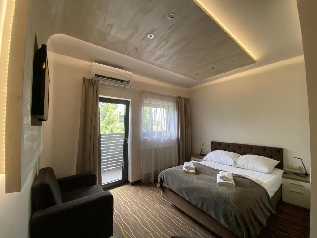 Postel nebo postele na pokoji v ubytování Hotel Wena