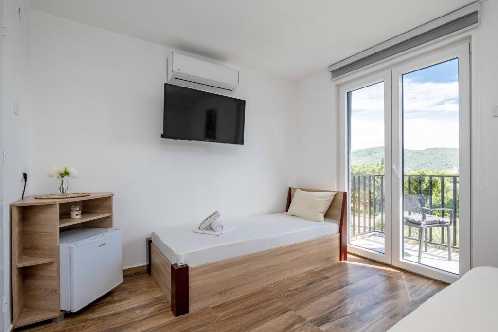 Postel nebo postele na pokoji v ubytování Sumice Inn