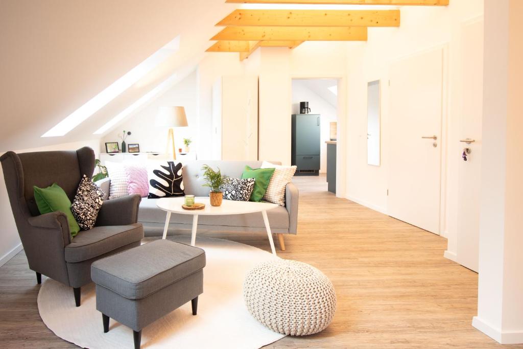 a living room with a couch and a table at Wanderers Inn Heidschnuckenweg in Undeloh