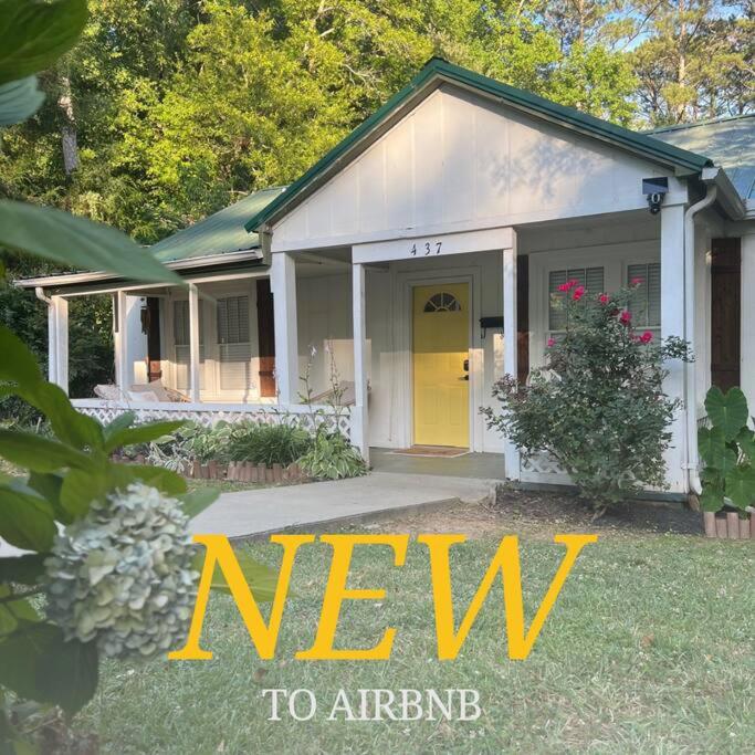 a new to arrive sign in front of a house at Quaint City Cottage Bremen, Ga in Bremen