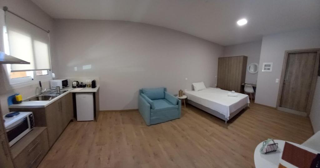 Łóżko lub łóżka w pokoju w obiekcie THALASSA ALMYROS APARTMENTS