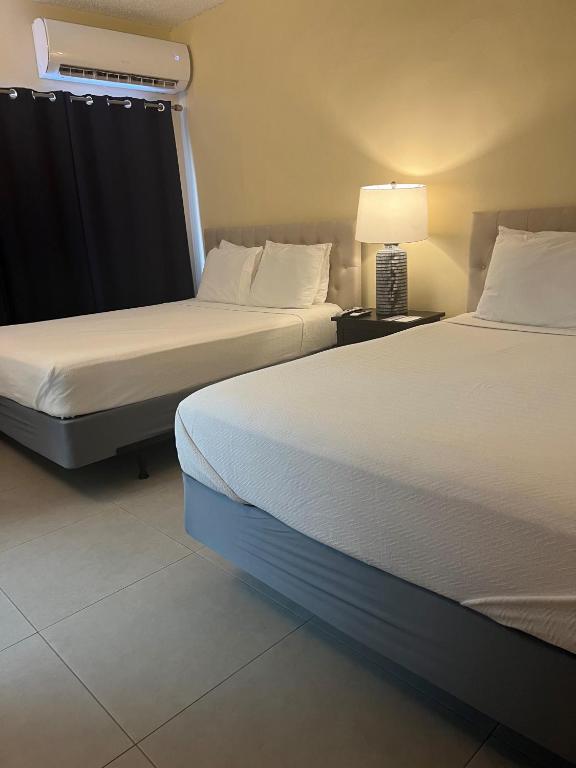 Postel nebo postele na pokoji v ubytování Hotel Villa del Sol