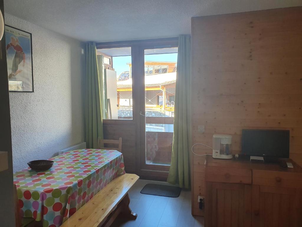 Кровать или кровати в номере Appart Alpe d Huez