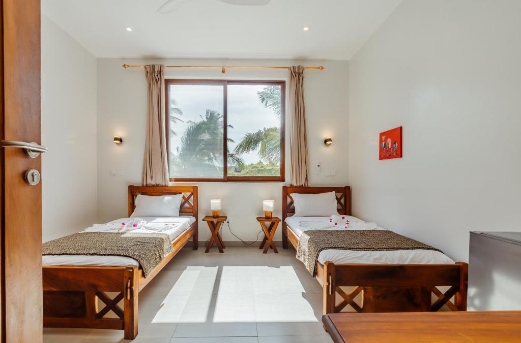 Postel nebo postele na pokoji v ubytování YU Resort