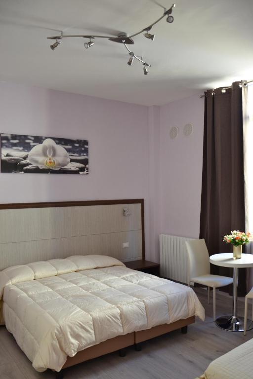Posteľ alebo postele v izbe v ubytovaní Florence Stadium B&B