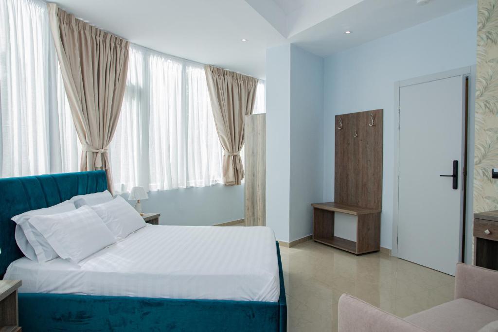 Postel nebo postele na pokoji v ubytování Alv Rent Rooms