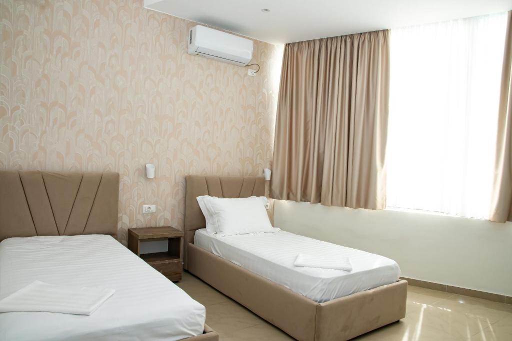 Postel nebo postele na pokoji v ubytování Alv Rent Rooms