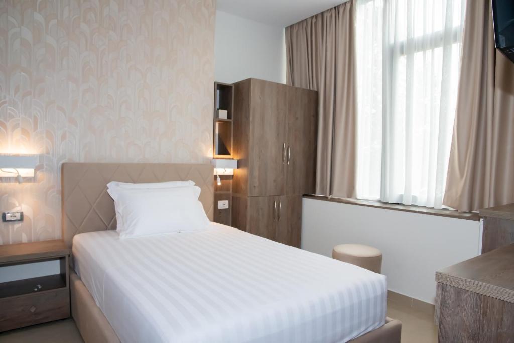 Postel nebo postele na pokoji v ubytování Alv Rent Rooms