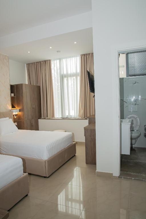 Postel nebo postele na pokoji v ubytování Alv Rent Rooms
