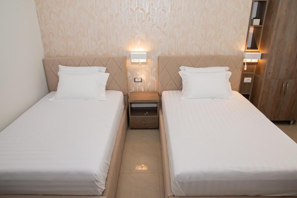 Postel nebo postele na pokoji v ubytování Alv Rent Rooms