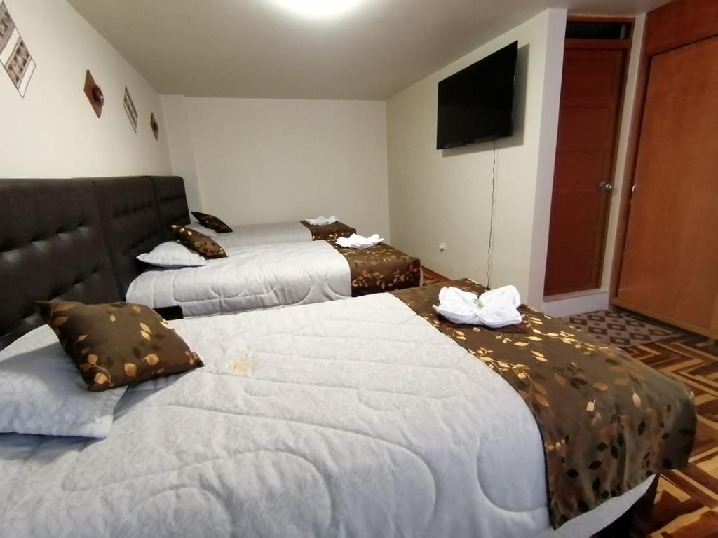 Postel nebo postele na pokoji v ubytování Hostal San Antonio Inn