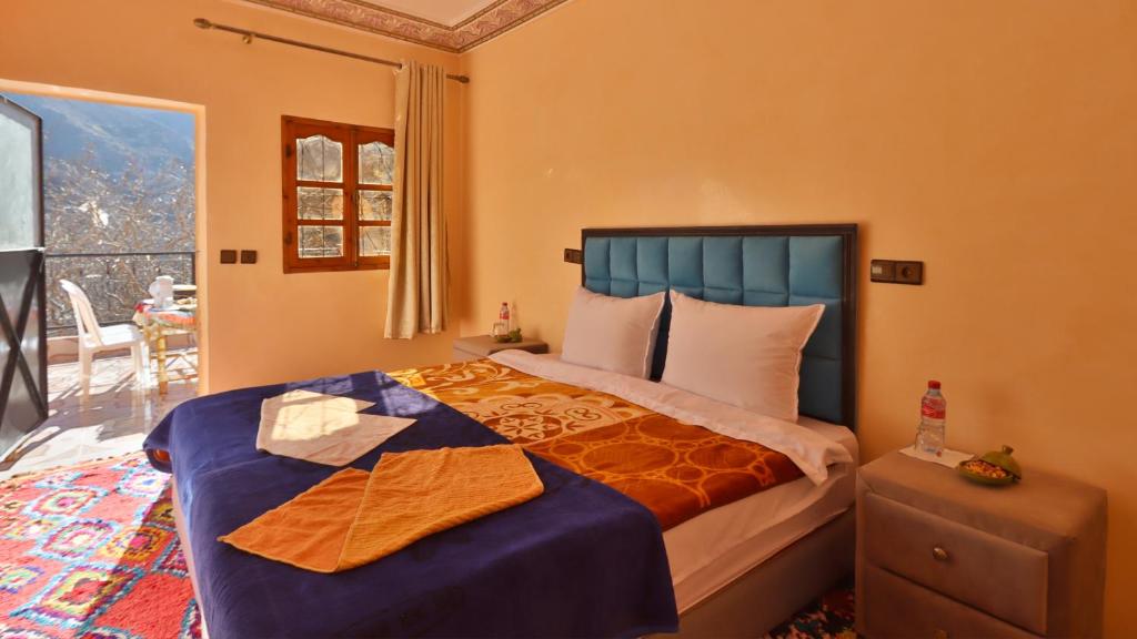 Postel nebo postele na pokoji v ubytování Dar Arghen Family Lodge