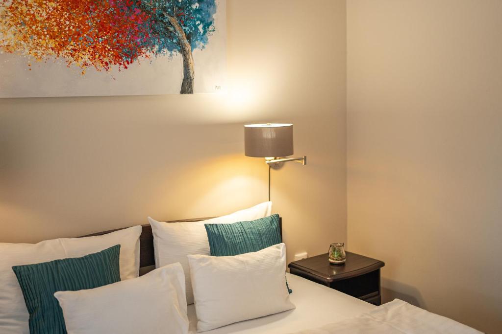 Postel nebo postele na pokoji v ubytování MeDoRa Park - Hotel MeDoRa***