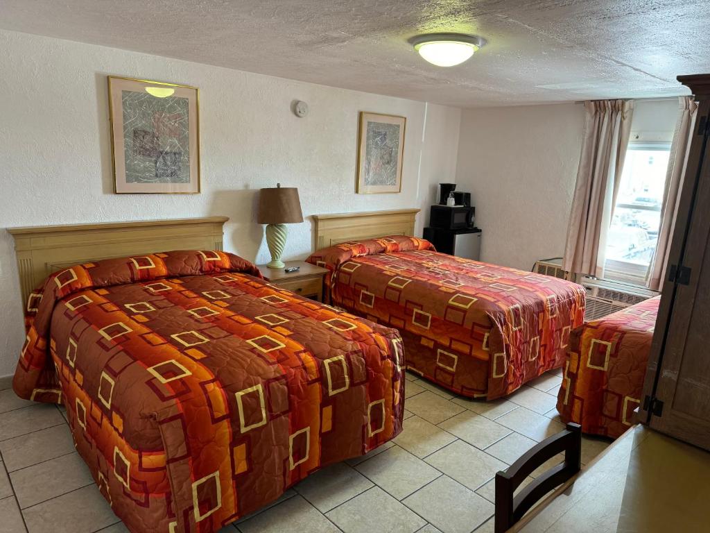 Postel nebo postele na pokoji v ubytování El Ray Motel