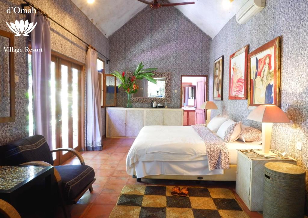 Letto o letti in una camera di D'omah Yogya Hotel