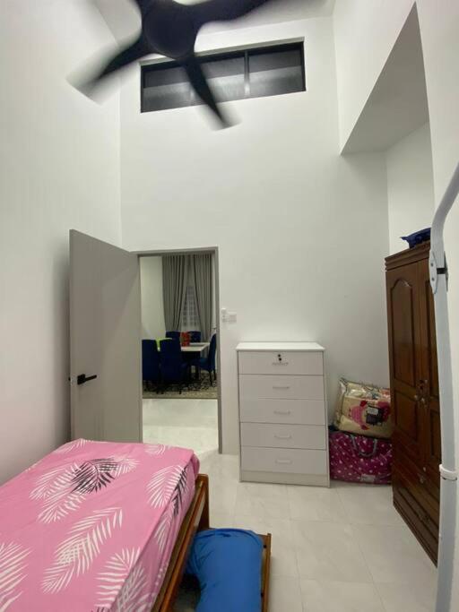 Postel nebo postele na pokoji v ubytování Homestay AZ