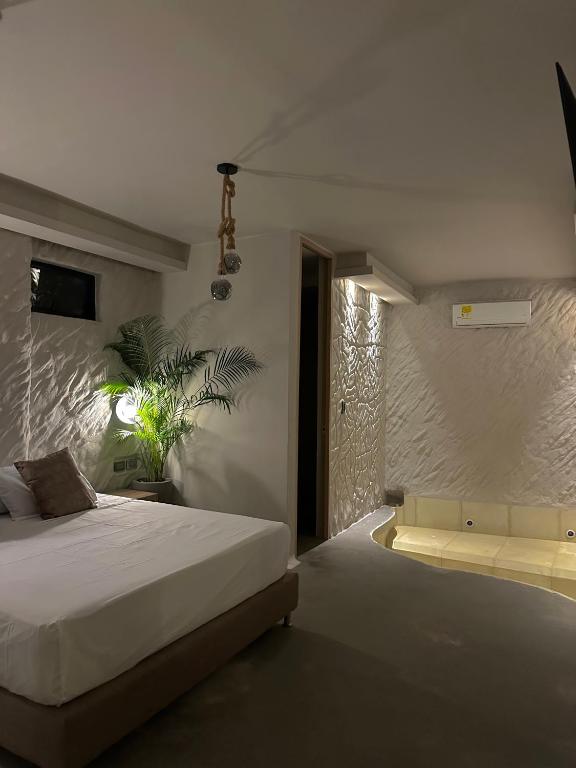 Postel nebo postele na pokoji v ubytování HOTEL BALI AT POBLADO