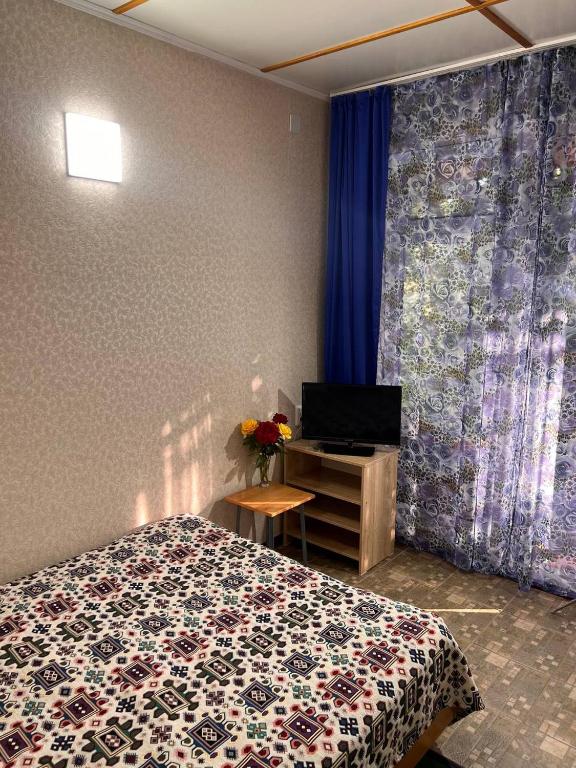 Postel nebo postele na pokoji v ubytování Podsolnukhi Guest House