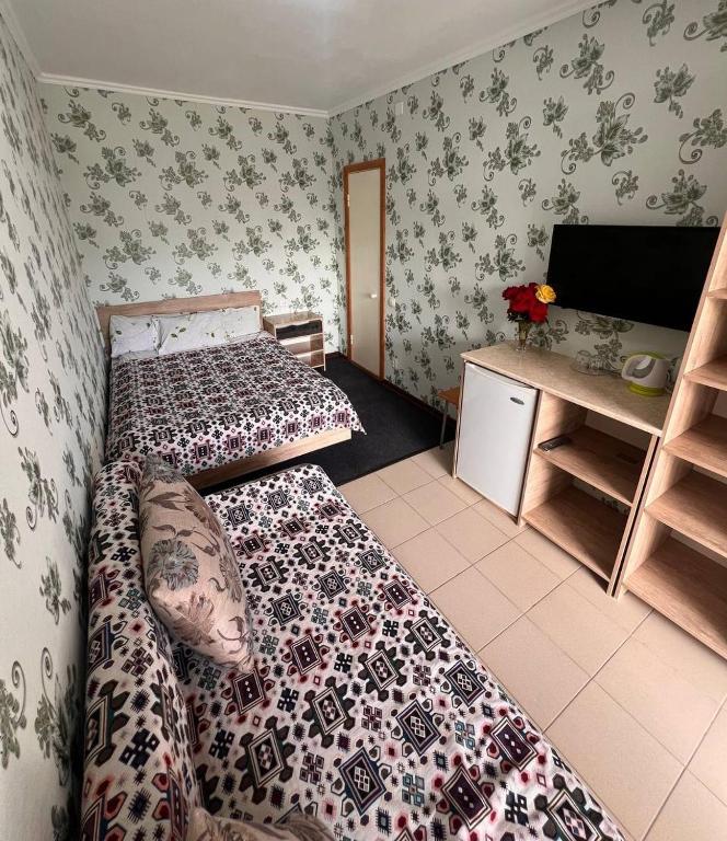 Postel nebo postele na pokoji v ubytování Podsolnukhi Guest House