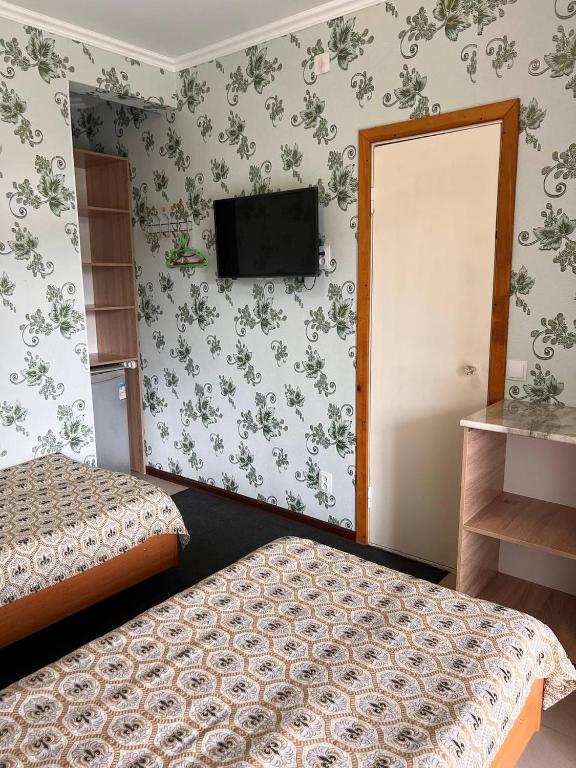 Postel nebo postele na pokoji v ubytování Podsolnukhi Guest House