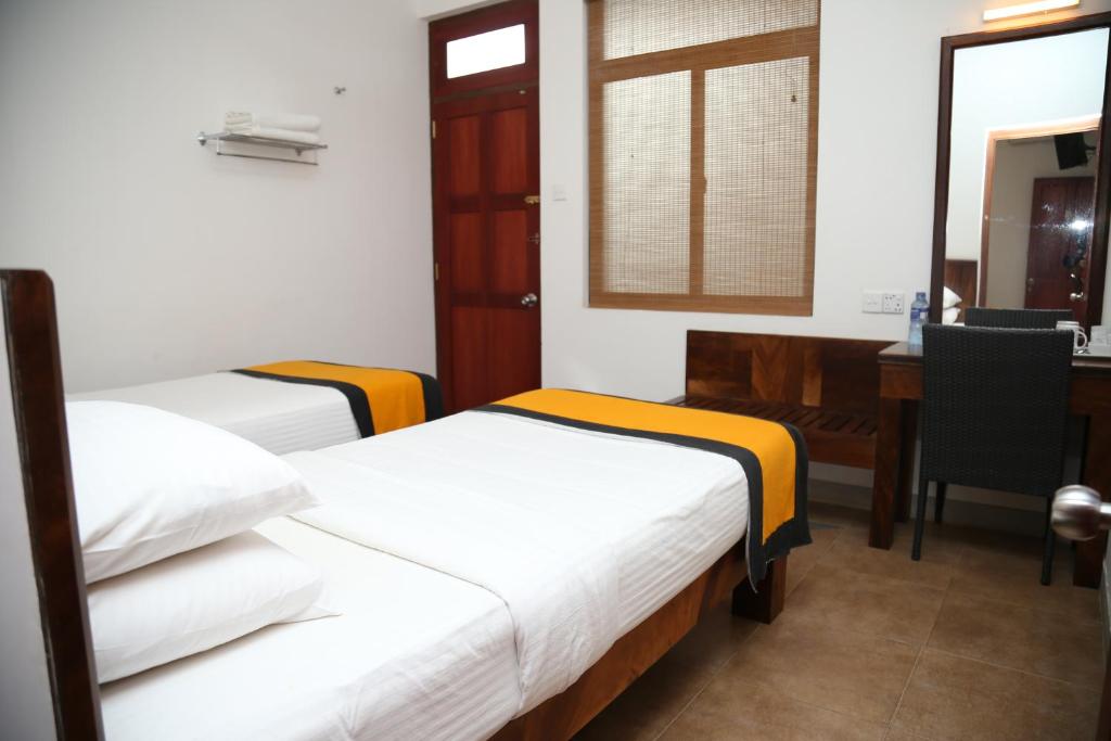 Postel nebo postele na pokoji v ubytování Spring Villas Kandy