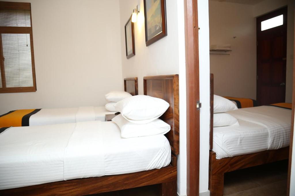 Postel nebo postele na pokoji v ubytování Spring Villas Kandy