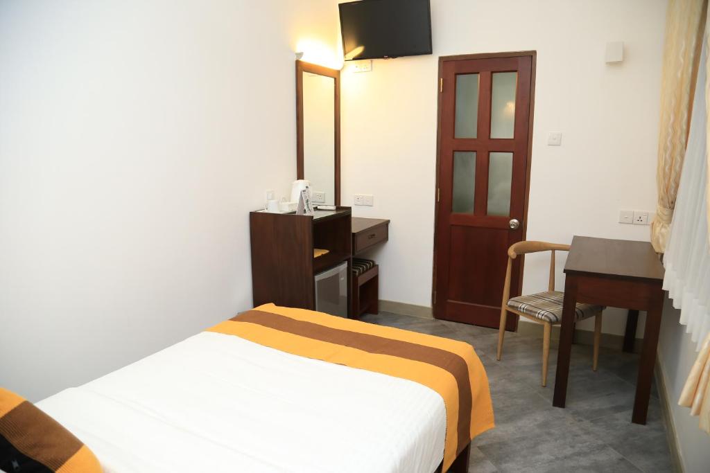 Postel nebo postele na pokoji v ubytování Spring Villas Kandy