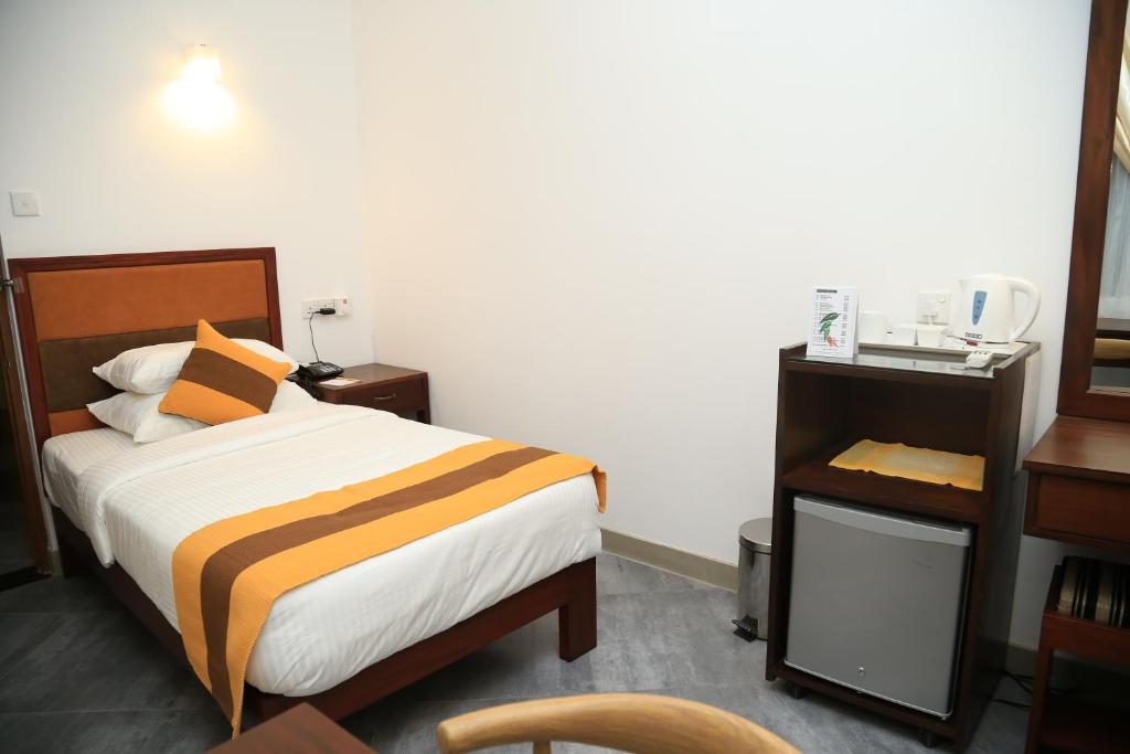 Postel nebo postele na pokoji v ubytování Spring Villas Kandy