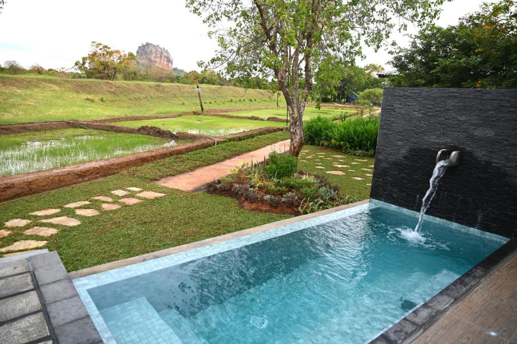 Bazén v ubytování Sigiriya King's Resort nebo v jeho okolí