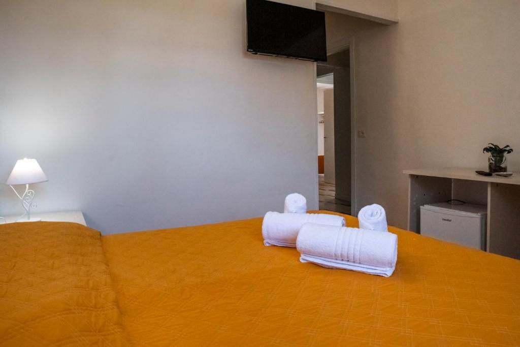Postel nebo postele na pokoji v ubytování SOLARIS PAESTUM