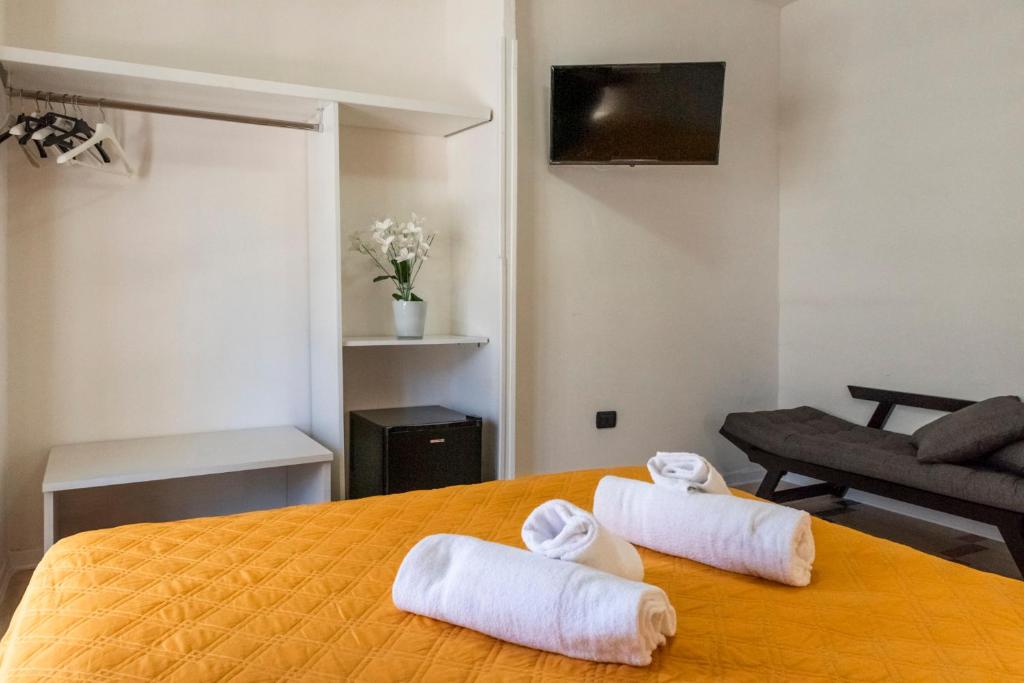 Postel nebo postele na pokoji v ubytování SOLARIS PAESTUM