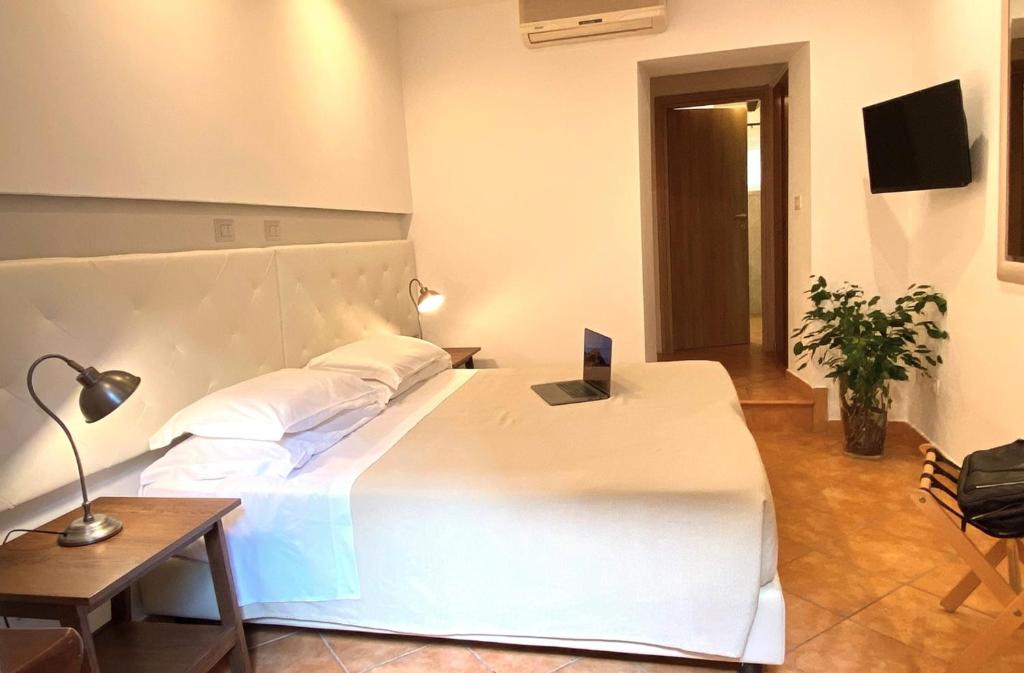 Postel nebo postele na pokoji v ubytování Orto Di Roma