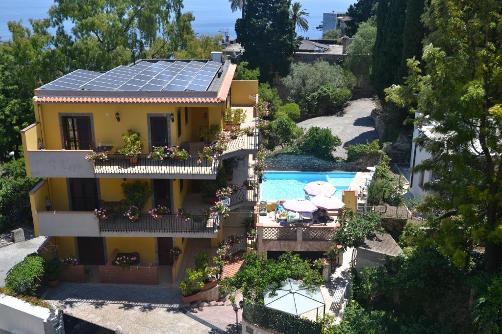 an aerial view of a house with solar panels on the roof at Residence Villa Il Glicine in Taormina